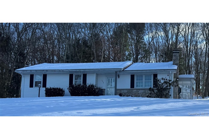 Ranch-style house featuring a chimney, stone siding, and covered porch