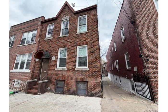View of front of property featuring brick siding