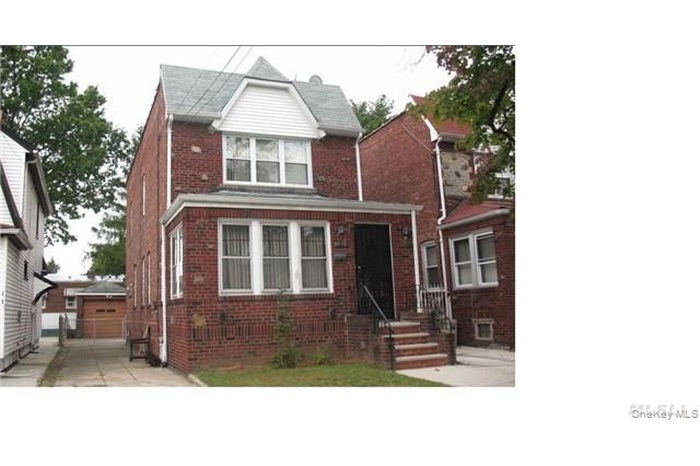 View of front facade featuring brick siding