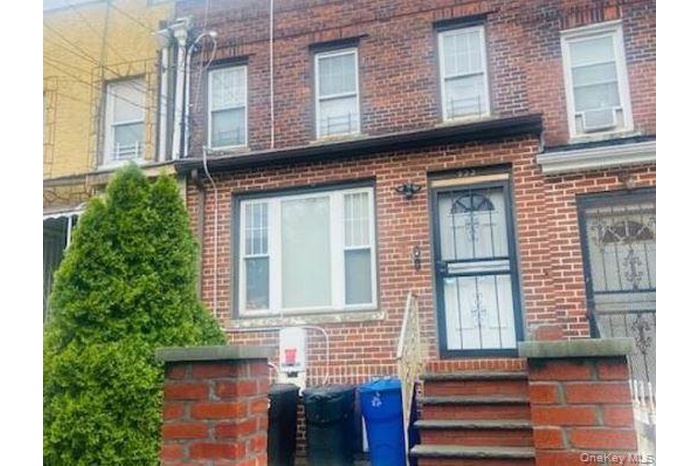 Doorway to property with brick siding