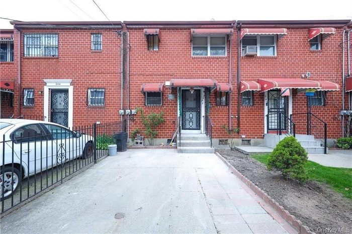 View of front of home featuring brick siding