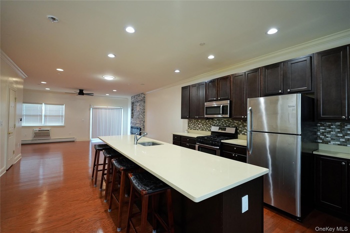 Large kitchen featuring open concept layout