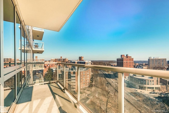 Balcony featuring a view of city