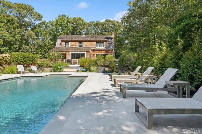 Set on a serene and private one-acre parcel