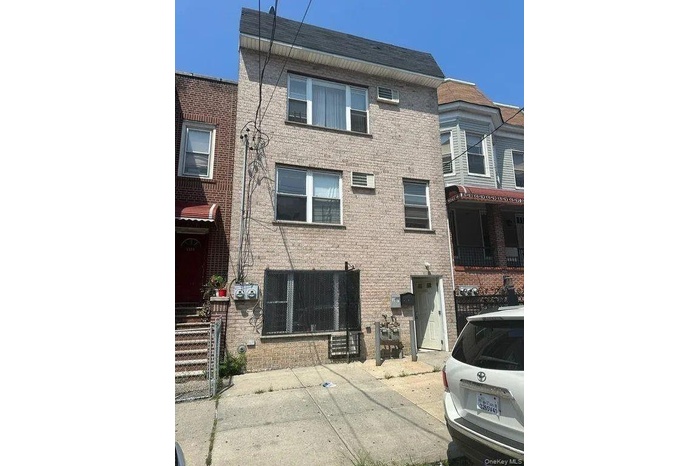 View of front of home featuring brick siding