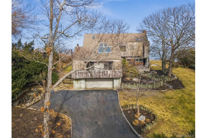 WELCOME to a spacious waterfront residence, just steps to the beach!