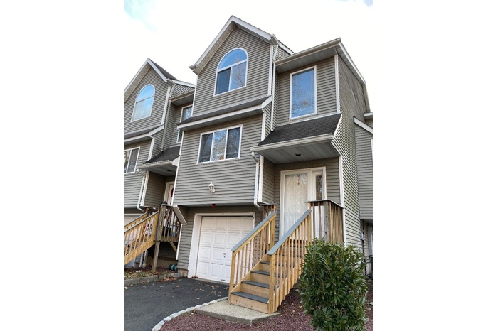 Young and spacious 2-3 bedroom, 2 full and 2 half bath, 3 level townhouse - an end unit with a garage and convenient additional parking steps away