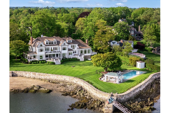 Aerial view of a large body of water and a pool area