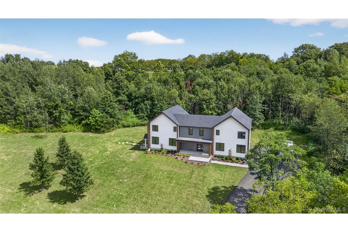 View from above of property with a heavily wooded area