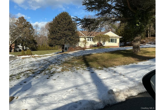 View of front of home featuring a lawn