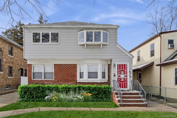 View of front facade featuring brick siding