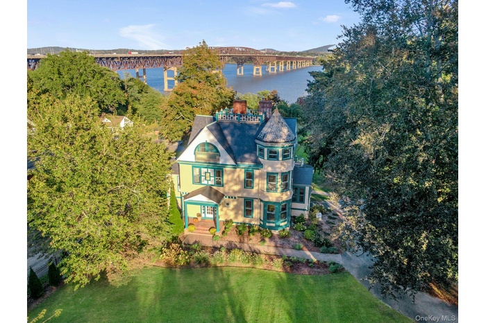 Aerial view of a nearby body of water and a notable bridge
