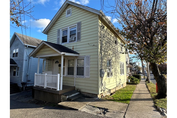 View of front of property with covered porch