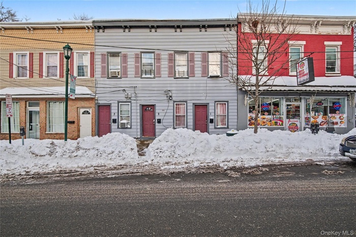 View of front of house with brick siding
