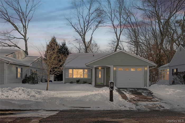 Single story home with a garage