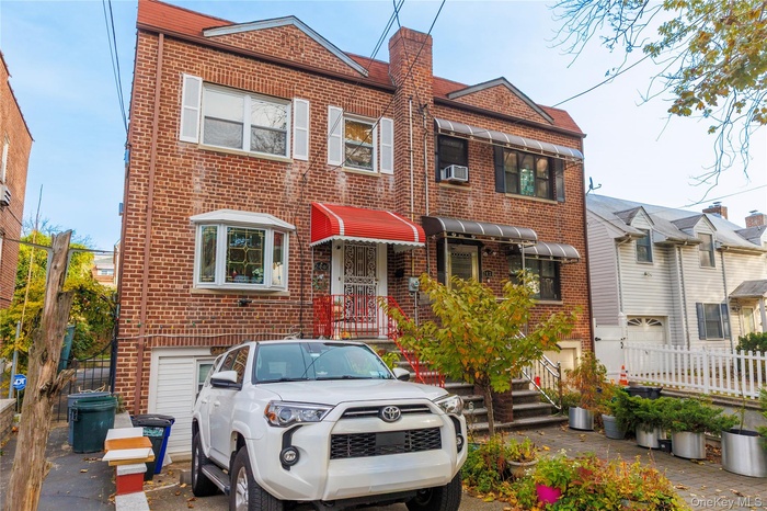 Traditional-style house featuring brick siding