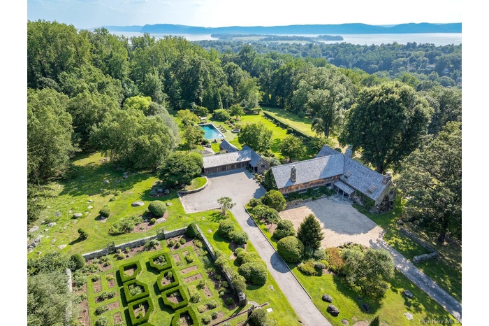 View of Main House, 4 car garage, and English Gardens with Hudson River view