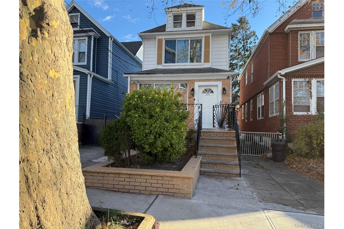 Traditional style home with roof with shingles
