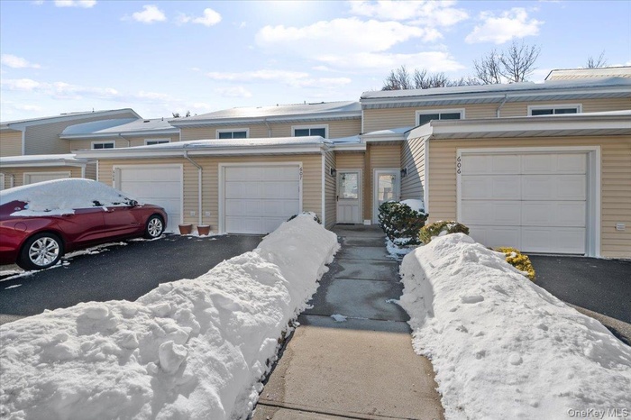 Front Door Entrance, Driveway and 1-Car Garage