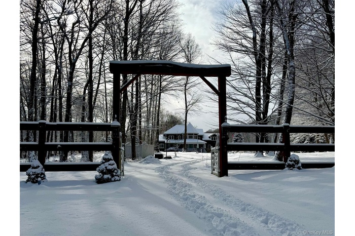 Wood Ranch Entrance with swing gates (swing gate excluded). This unique entry is the start of an exciting next step to call this lovely home your own!