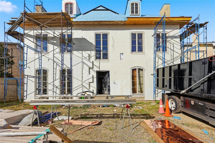 Back of property with stucco siding