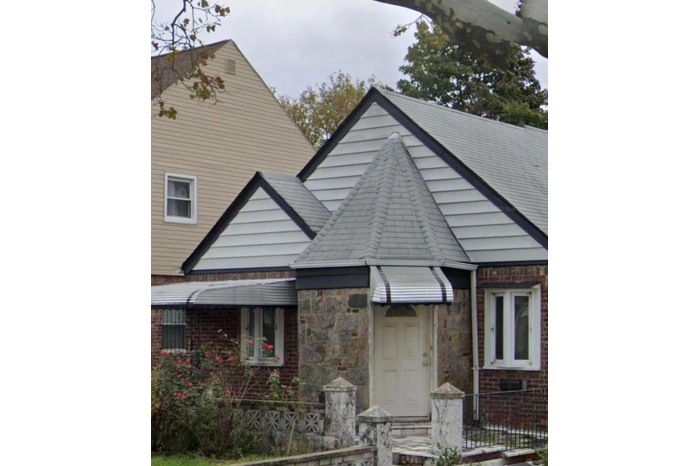 View of front of property featuring brick siding