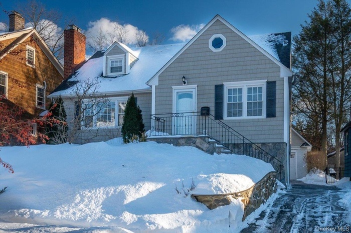 View of front of home featuring a chimney