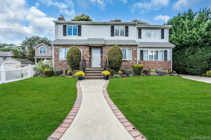 Traditional home with brick siding and a chimney