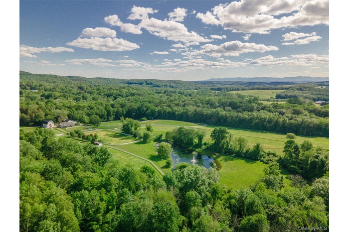 Bird's eye view of a large body of water and a heavily wooded area