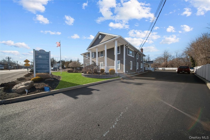 View of asphalt road featuring curbs
