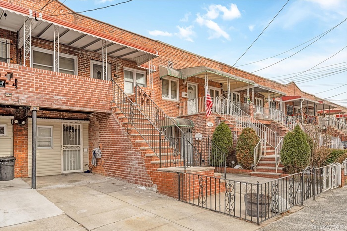 Traditional-style house featuring stairway and brick siding