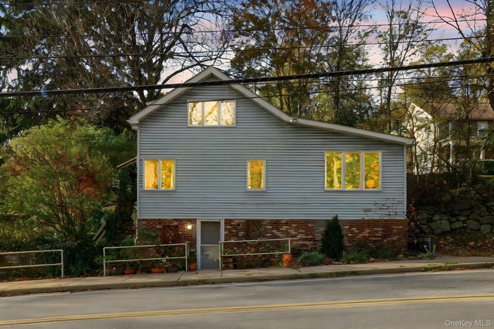 View of side of home with brick siding