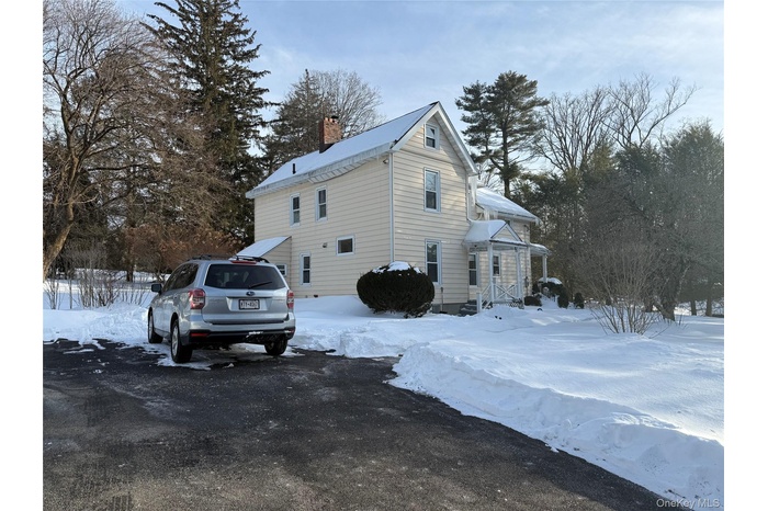 Duplex with 2 driveway parking spaces