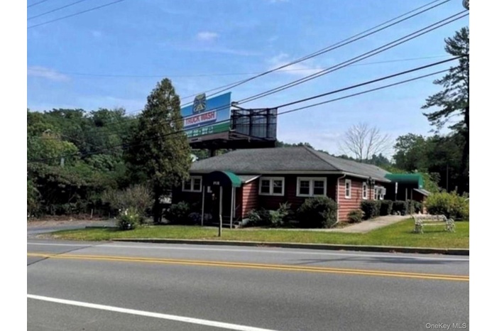 View of front of property with a front yard