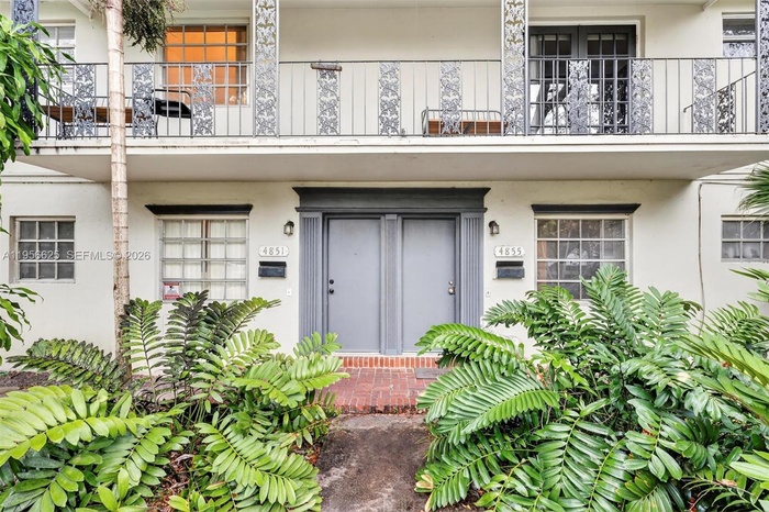 This rare property features two condo units within one structure on an oversized lot, offering exceptional potential for redevelopment into a bespoke 