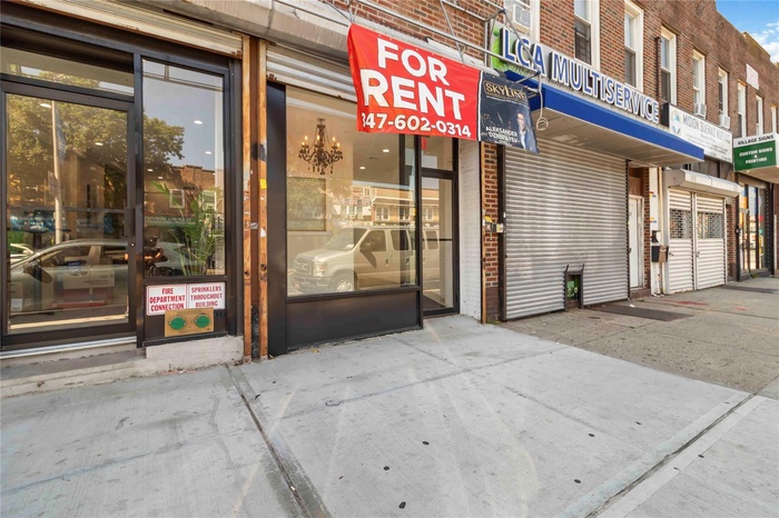 Doorway to property featuring brick siding