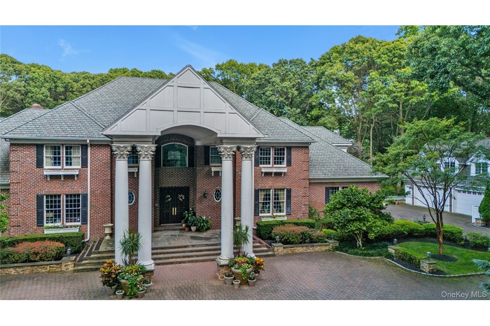 Aerial view of house and detached garage