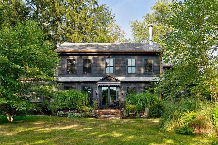 View of front of property with a front yard
