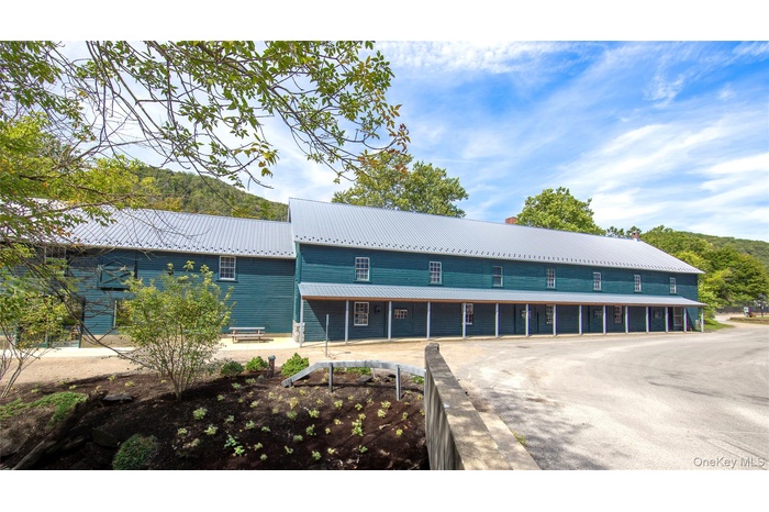 Nestled in the heart of Wassaic Hamlet on Main Street, this meticulously revitalized 1920s two-story barn, spanning 10,640 SF, stands as a testament t