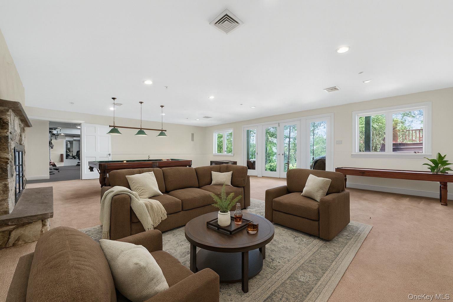 Virtually Staged Living room featuring light carpet, recessed lighting, french doors, and billiards