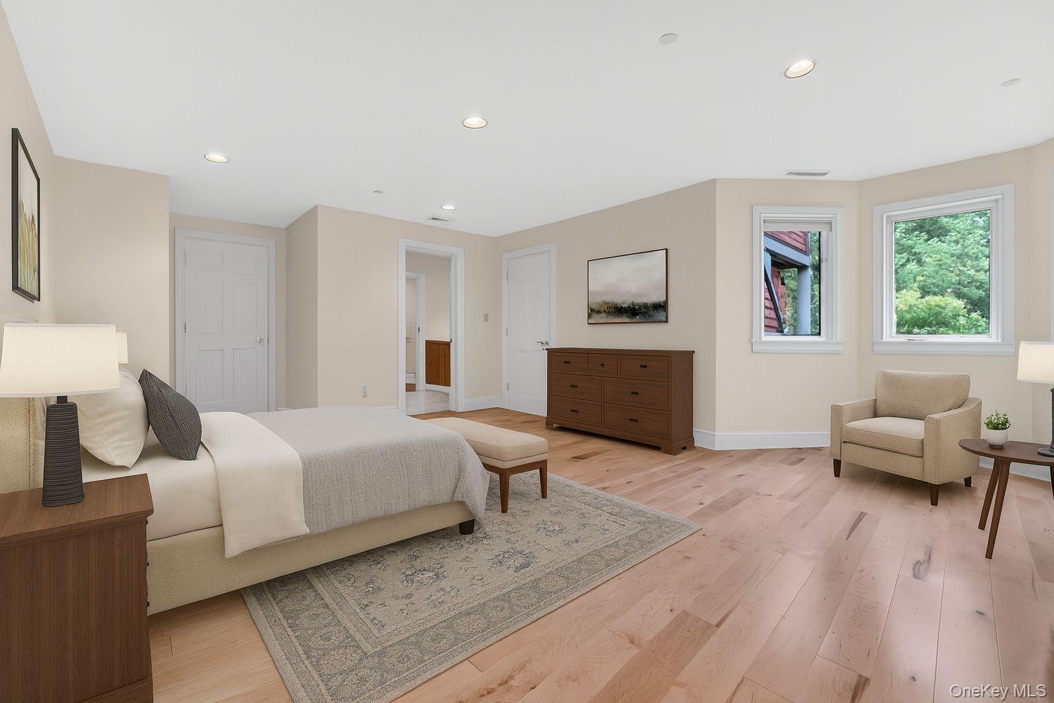 Virtually Staged Bedroom with light wood-style floors and recessed lighting