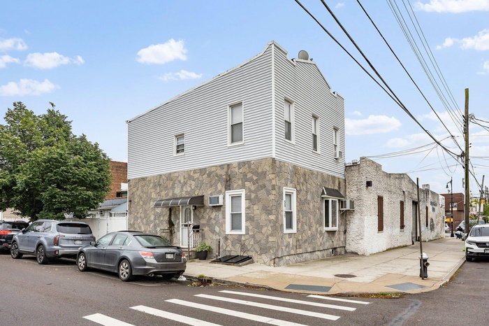 View of front facade with stone siding