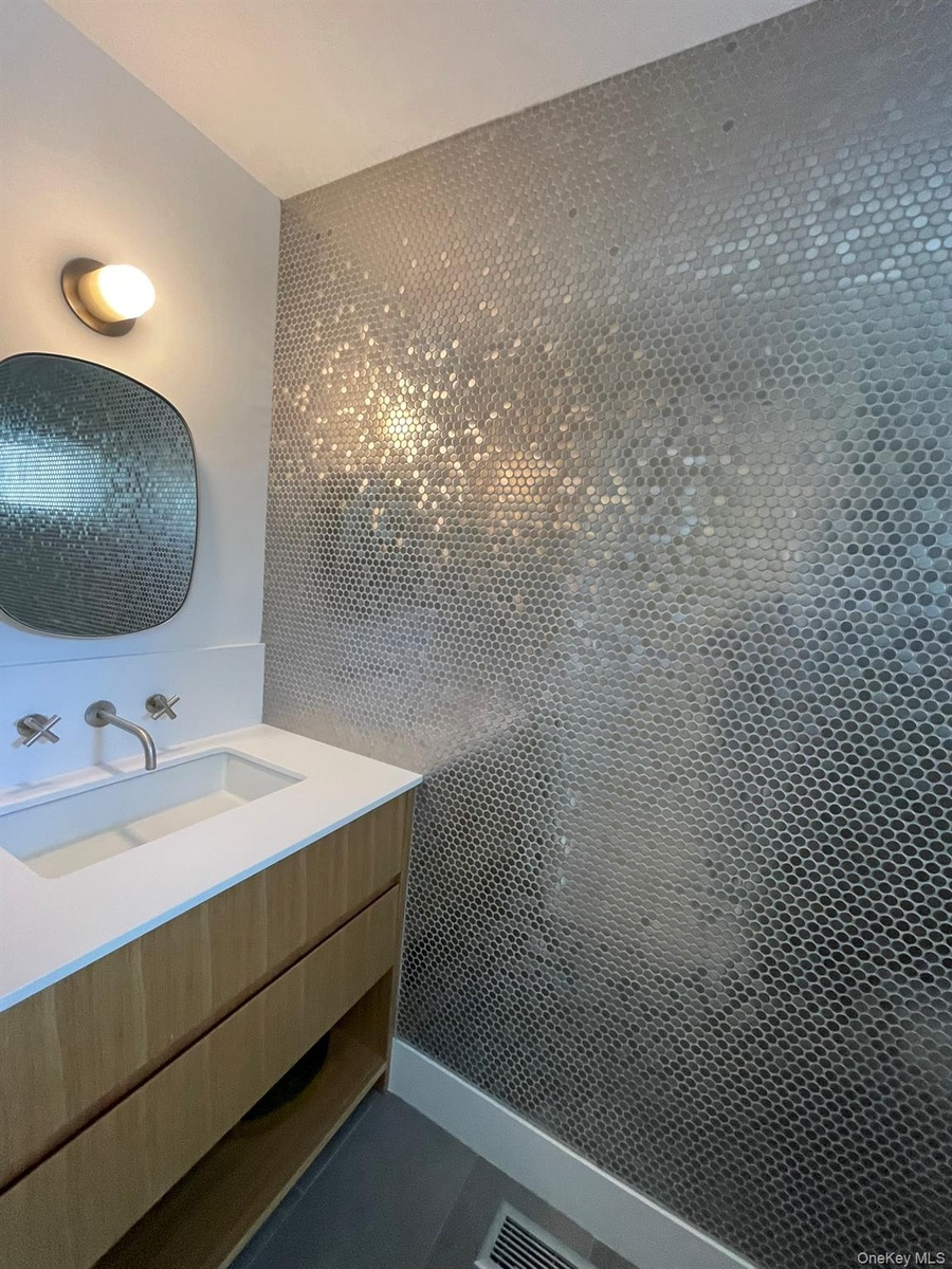 Bathroom with visible vents and vanity