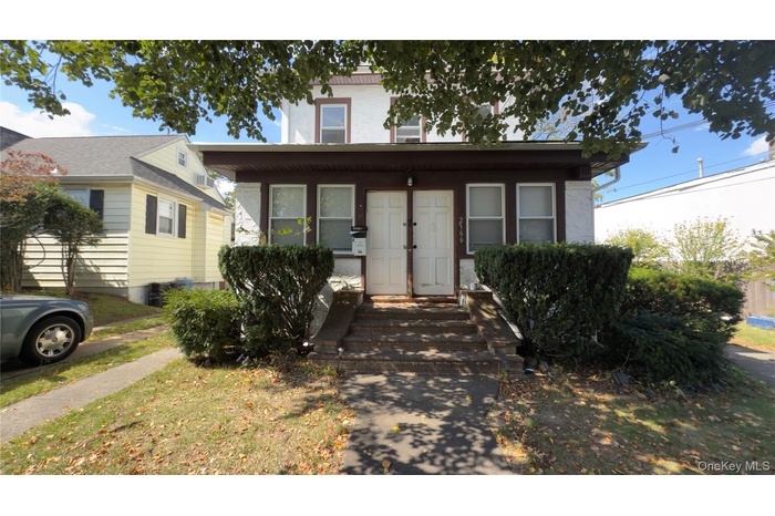 View of front of home featuring stucco siding