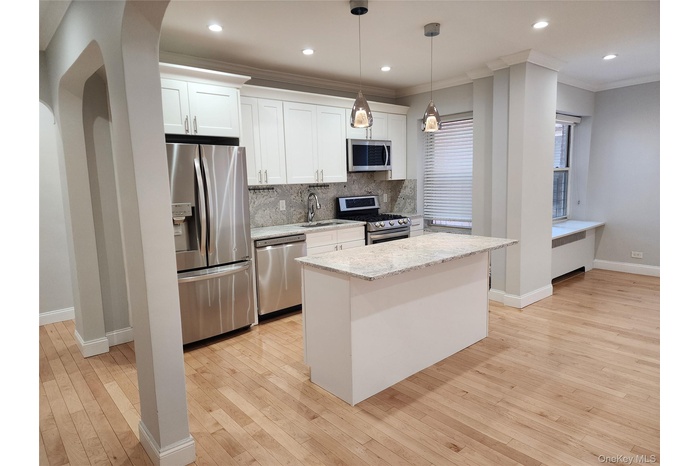 Open Concept Kitchen with Counter / Breakfast bar - place stools in front option.