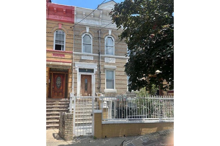 View of front of house with brick siding