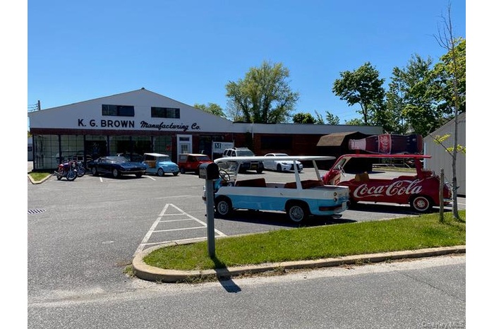 Highly visible industrial asset with prominent frontage and dedicated parking field.Strategic positioning along a well-traveled commercial corridor.