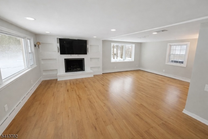 Living Room w/ woodburning fpl