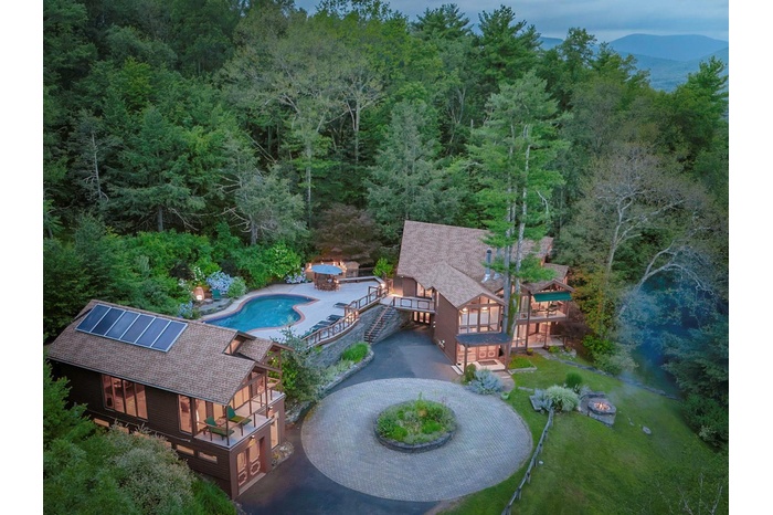 Bird's eye view featuring a view of heated pool