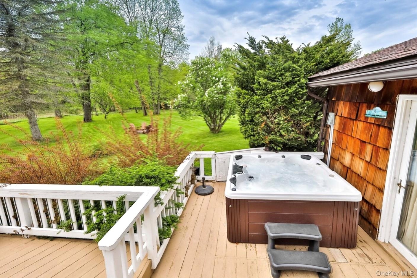 Wooden deck with a hot tub